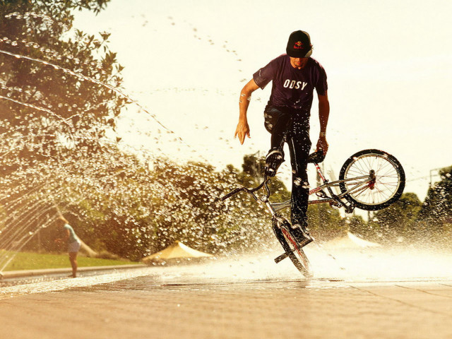 Man bike trick water wheel free wallpaper for desktop - medium preview image
