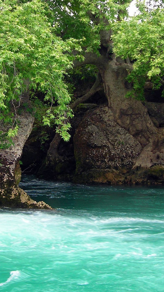 Man kayaking river rock formation free wallpaper for mobile - medium preview image