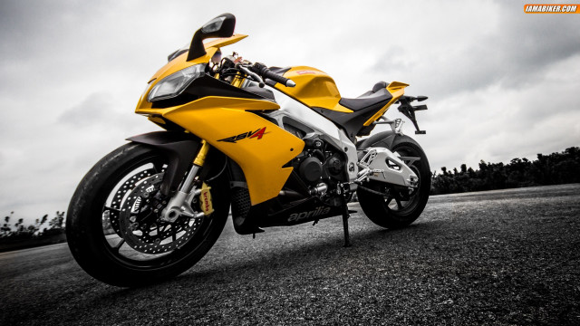 Yellow motorcycle gravel road cloudy free wallpaper for desktop - medium preview image