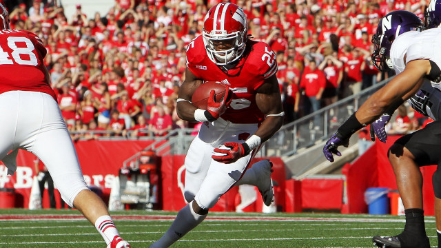 Football player running ball crowd #2 free wallpaper for desktop - medium preview image