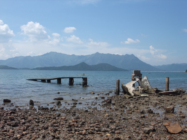 Boat water rocky shore mountains free wallpaper for desktop - medium preview image