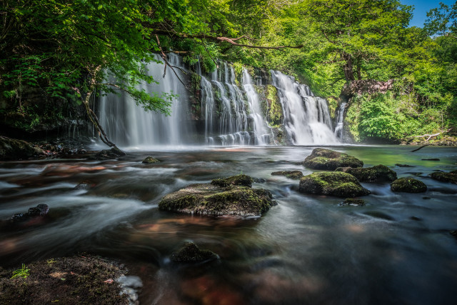 Waterfall rocks trees blue sky free wallpaper for desktop - medium preview image