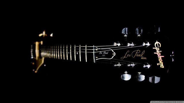 Guitar closeup black background gold free wallpaper for desktop - medium preview image