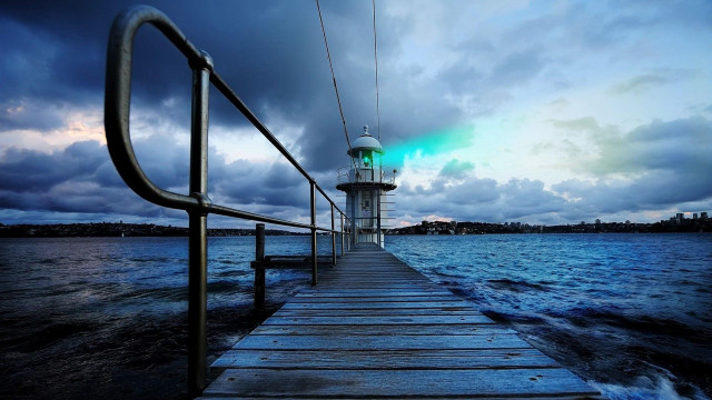 Pier lighthouse night cloudy sky free wallpaper for desktop - medium preview image