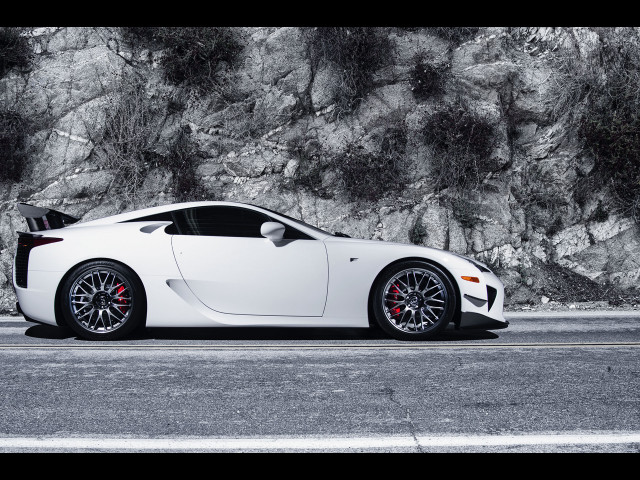 White sports car mountain rock free wallpaper for desktop - medium preview image
