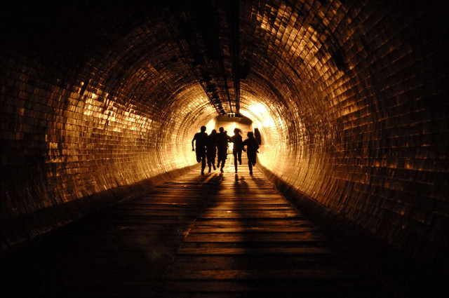 People walking tunnel dark light free wallpaper for desktop - medium preview image