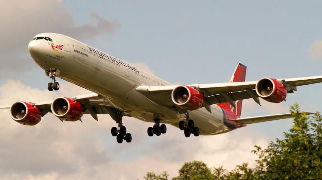 Jetliner cloudy sky trees bushes free wallpaper for desktop - medium preview image