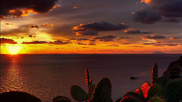 Sunset water boat mountain clouds free wallpaper for desktop - medium preview image