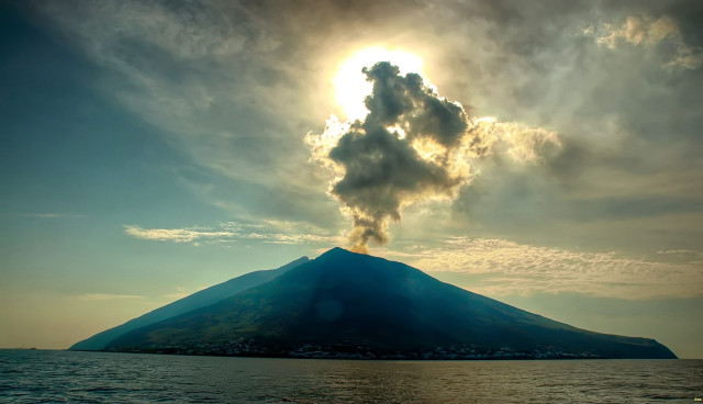 Volcano smoke water boat foreground free wallpaper for desktop - medium preview image
