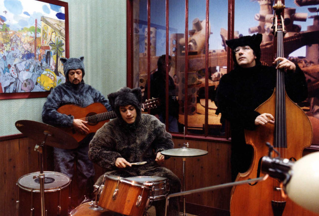 Costumed people playing instruments room free wallpaper for desktop - medium preview image