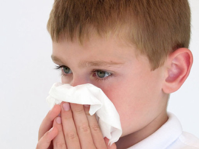 Young boy blowing nose napkin free wallpaper for desktop - medium preview image