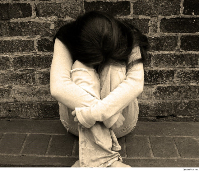 Woman sitting ground head down free wallpaper for desktop - medium preview image