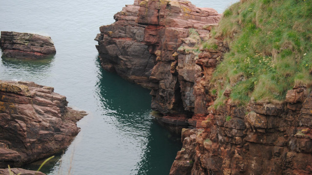 Water rocky cliffs grass hills free wallpaper for desktop - medium preview image