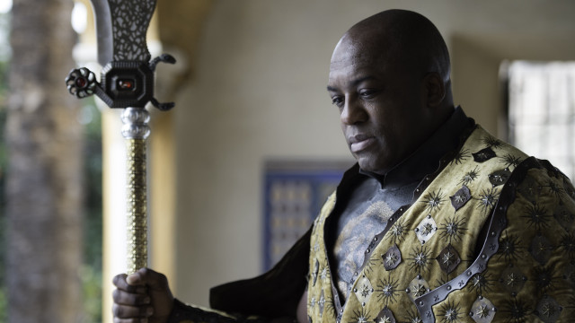 Man yellow shirt sword serious free wallpaper for desktop - medium preview image