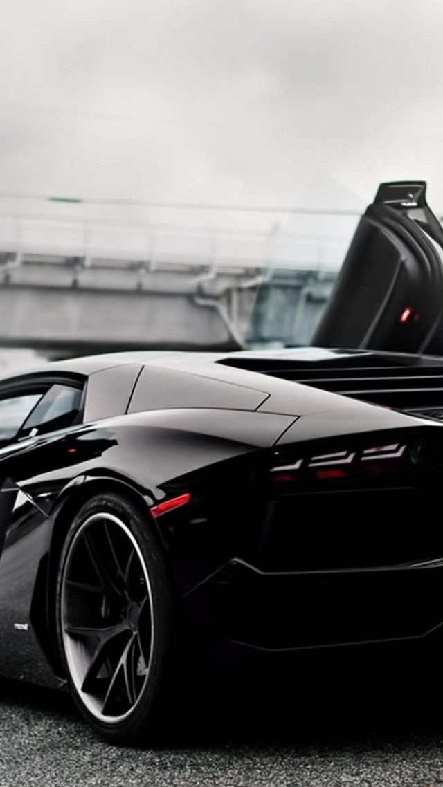 Black sports car parked road free wallpaper for mobile - medium preview image