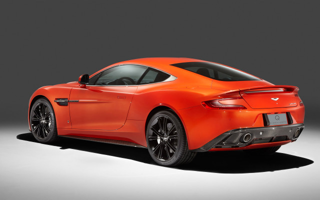 Bright orange sports car studio free wallpaper for desktop - medium preview image