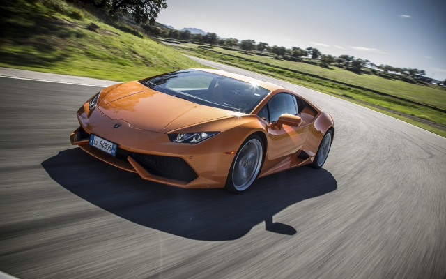 Orange sports car daytime road free wallpaper for desktop - medium preview image