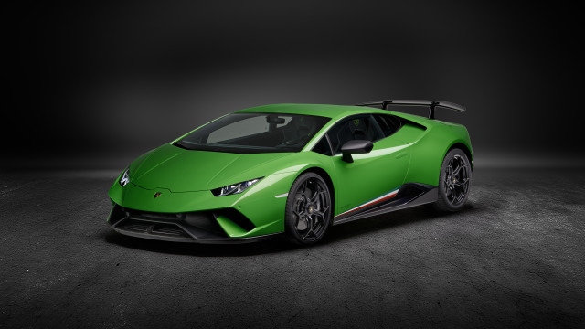 Green sports car dark room free wallpaper for desktop - medium preview image
