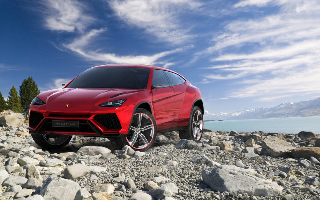 Red sports car rocky beach free wallpaper for desktop - medium preview image