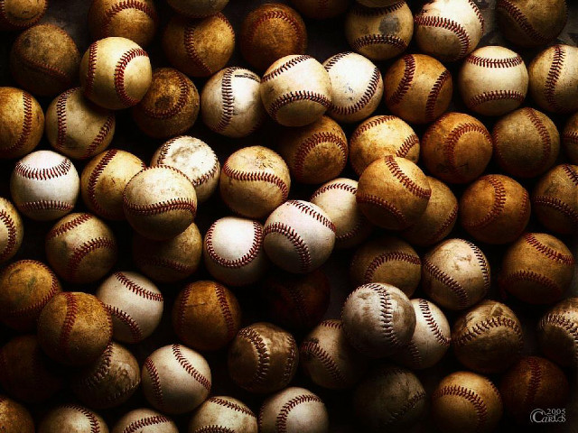 Baseballs pile tabletop black background free wallpaper for desktop - medium preview image