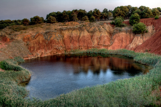 Small lake cliff grass hillside free wallpaper for desktop - medium preview image