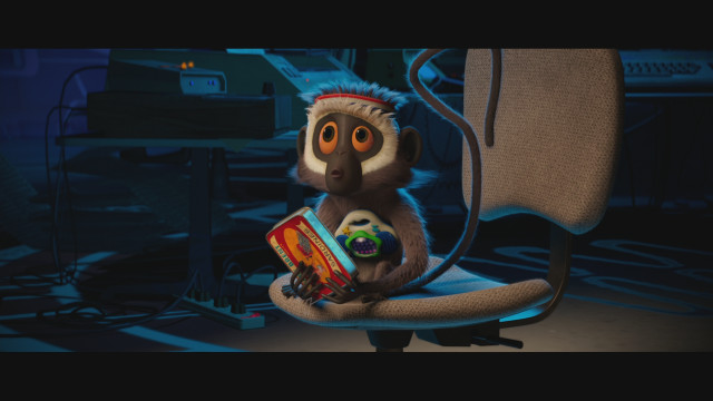 Monkey sitting chair book remote free wallpaper for desktop - medium preview image