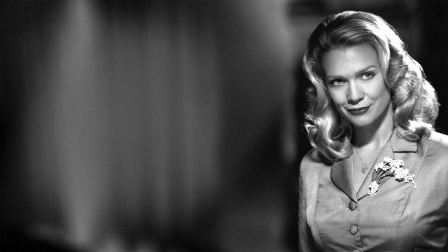 Woman flower hair smiling camera free wallpaper for desktop - medium preview image