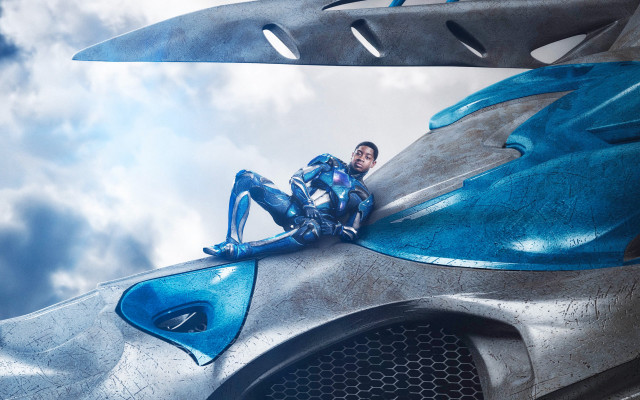 Futuristic man suit sitting car free wallpaper for desktop - medium preview image