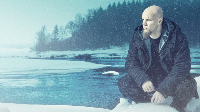 Bald man sitting rock snow free wallpaper for desktop - medium preview image