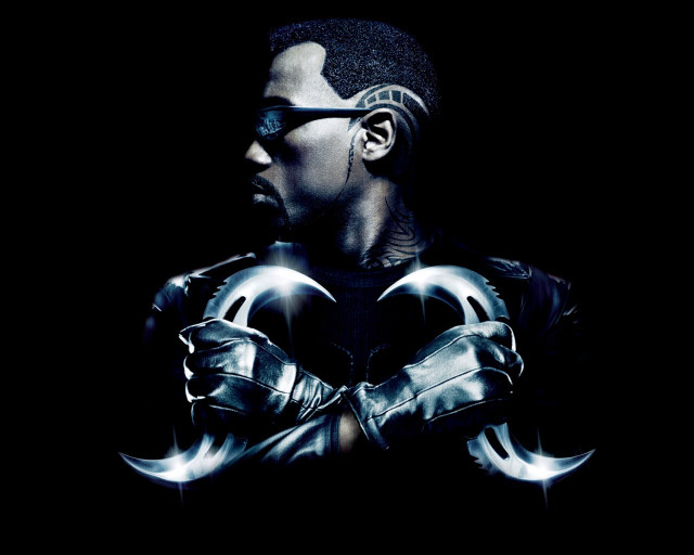 Man black shirt glasses holding free wallpaper for desktop - medium preview image