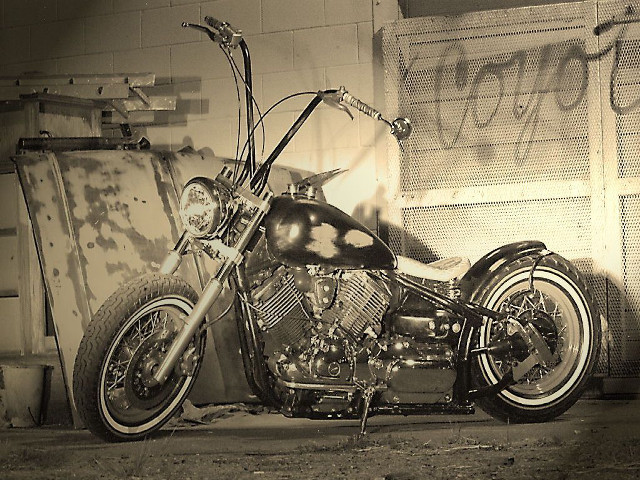 Motorcycle parked graffiti wall door free wallpaper for desktop - medium preview image