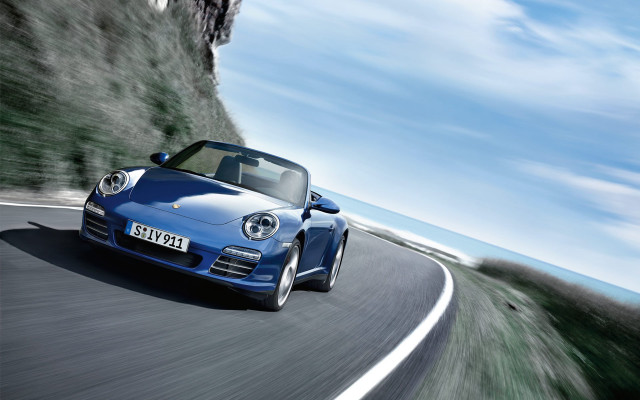 Blue porsche sports car cliff free wallpaper for desktop - medium preview image