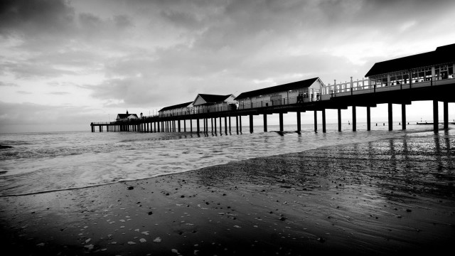 Pier houses water waves scenery free wallpaper for desktop - medium preview image