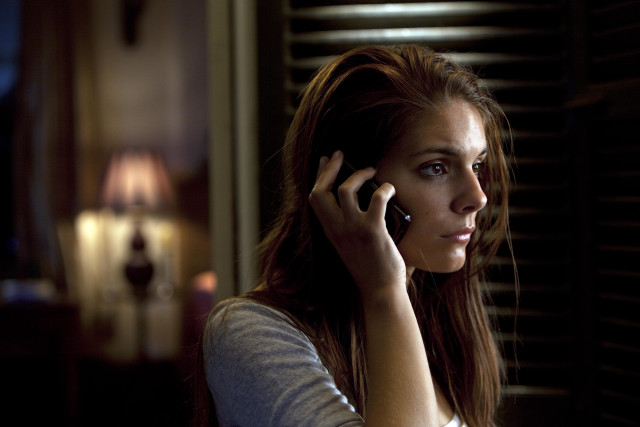 Woman talking cellphone dark room free wallpaper for desktop - medium preview image