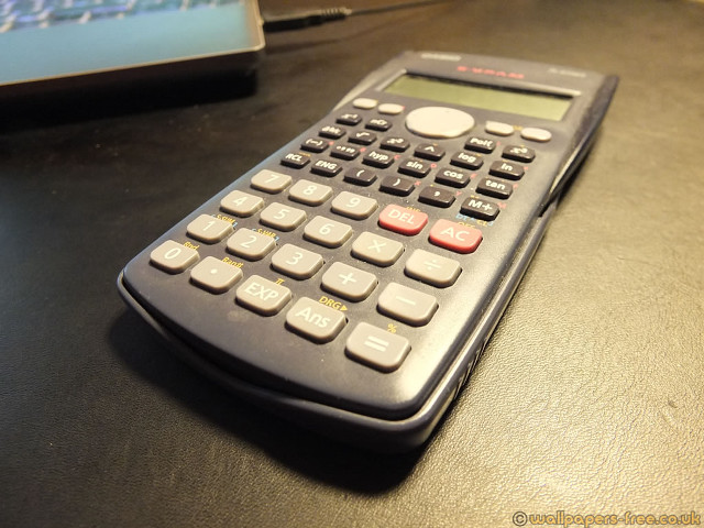 Calculator laptop table black surface free wallpaper for desktop - medium preview image