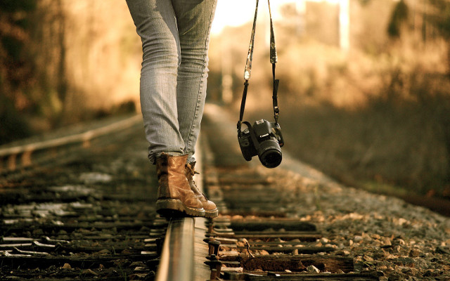 Person walking train track camera free wallpaper for desktop - medium preview image