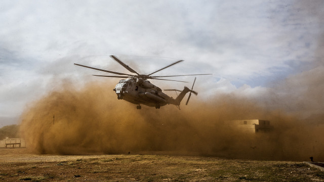 Helicopter dirt field cloudy sky free wallpaper for desktop - medium preview image