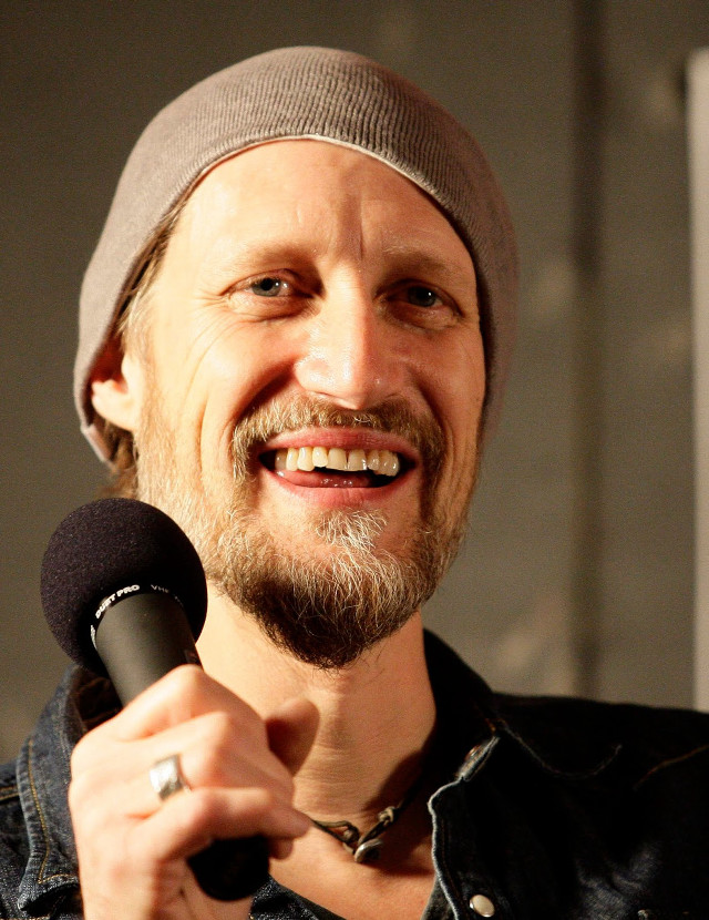 Bearded man beanie microphone portrait free wallpaper for mobile - medium preview image