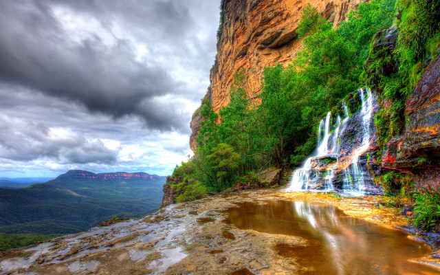 Waterfall cascading valley mountain background free wallpaper for desktop - medium preview image
