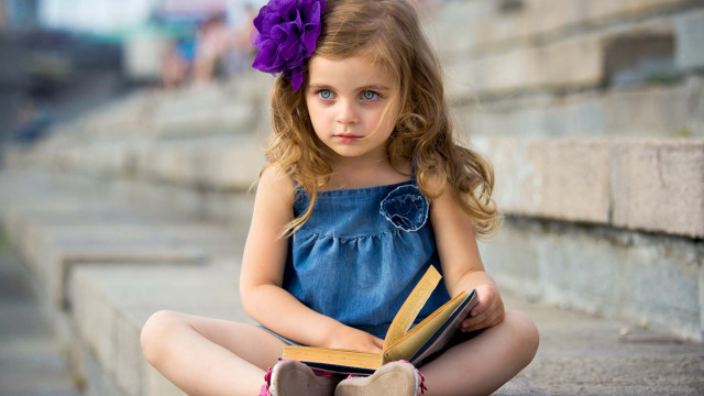 Little girl sitting book lap free wallpaper for desktop - medium preview image