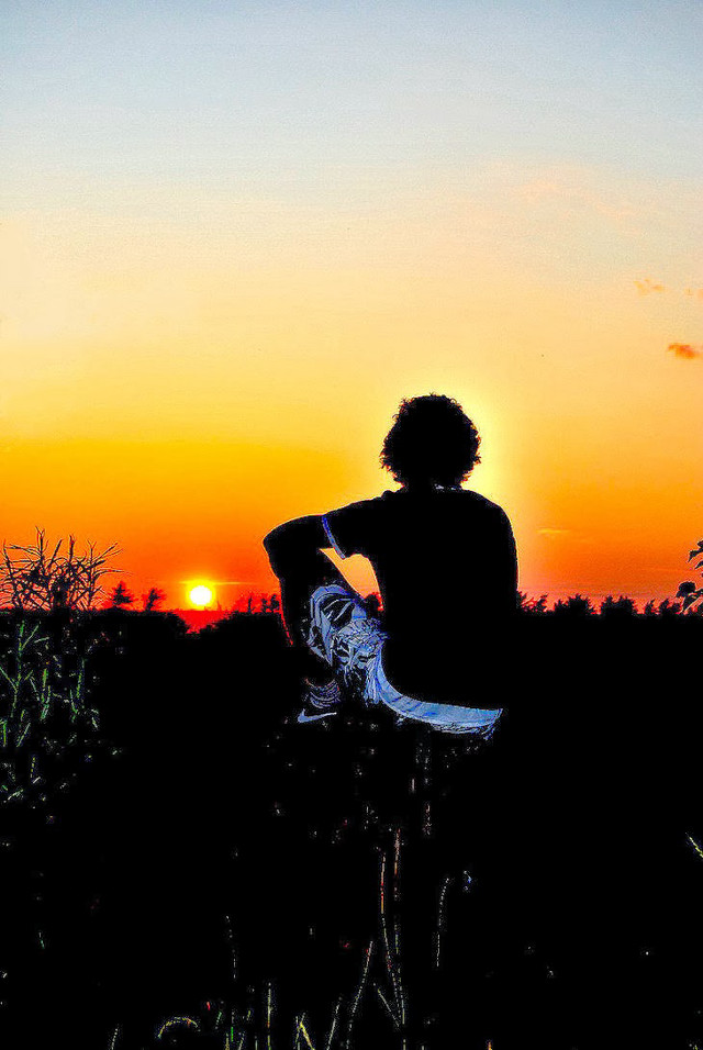 Person sitting field sunset skateboard free wallpaper for mobile - medium preview image