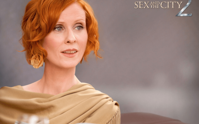 Woman red hair cape gray free wallpaper for desktop - medium preview image