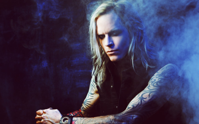 Man long hair tattoos sitting #2 free wallpaper for desktop - medium preview image
