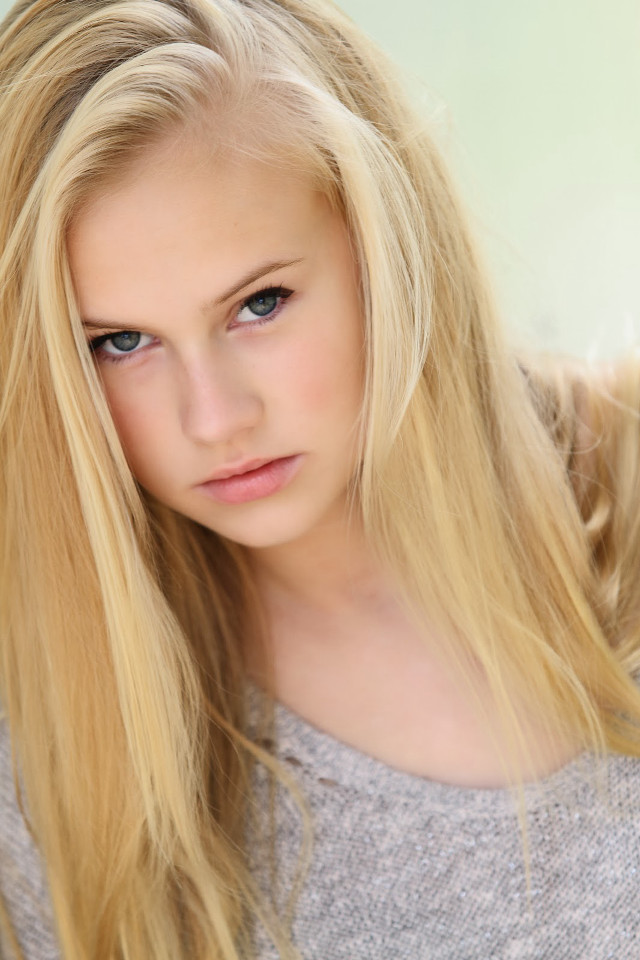 Blonde woman blue eyes serious #7 free wallpaper for mobile - medium preview image