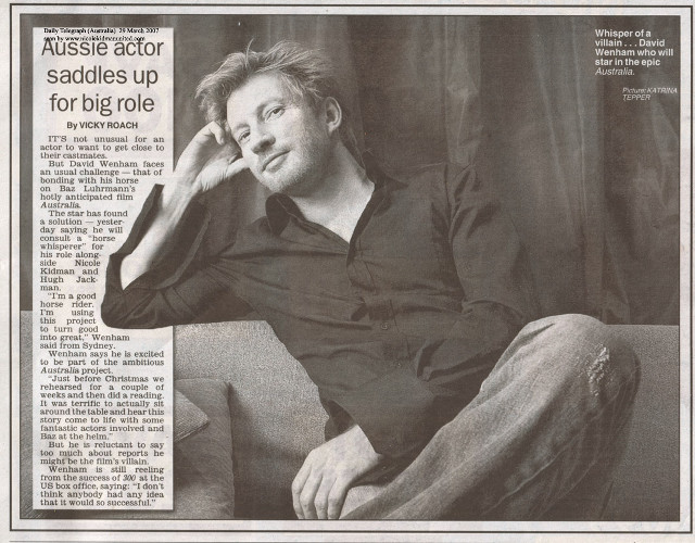 Man sitting couch newspaper hand free wallpaper for desktop - medium preview image