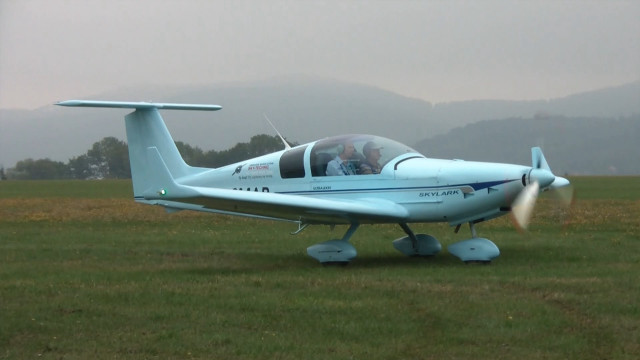 Small blue plane green field free wallpaper for desktop - medium preview image