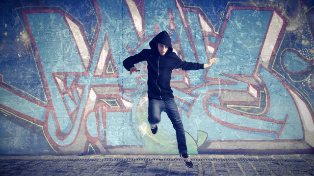 Man black hoodie skateboarding graffiti free wallpaper for desktop - medium preview image