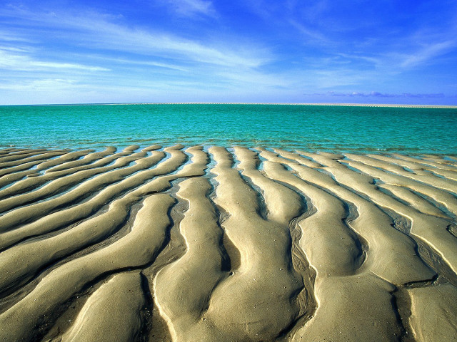 Sandy beach blue sky water free wallpaper for desktop - medium preview image
