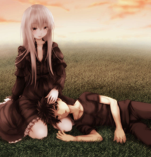 Couple laying lush green field free wallpaper for tablet - medium preview image