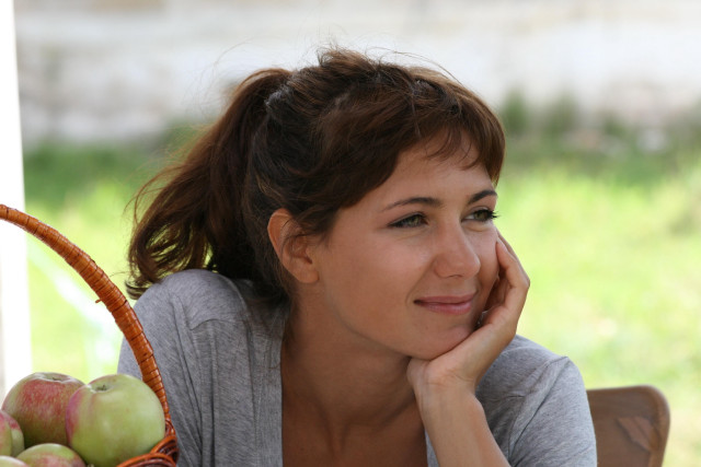 Woman sitting table basket apples free wallpaper for desktop - medium preview image